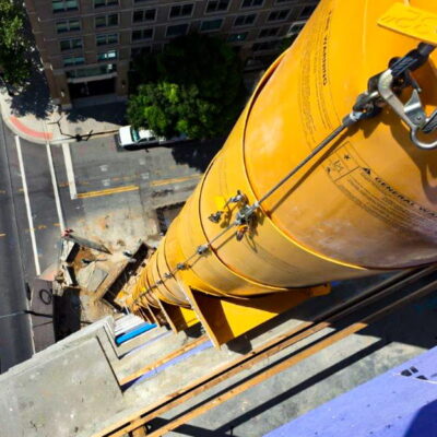 Top view of a yellow Superchute on a high-rise building.